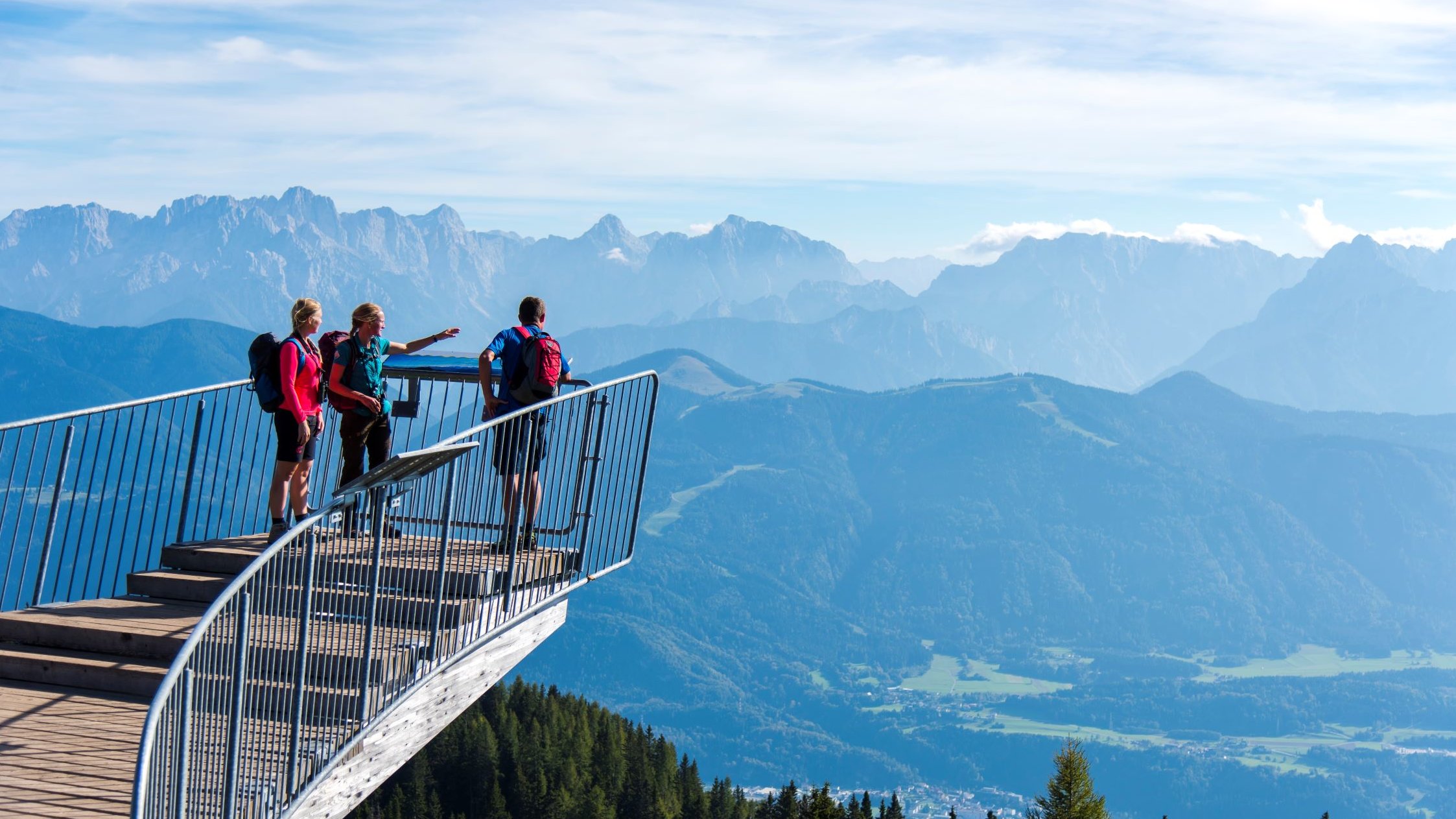 Hikers are amazed by the beautiful view from Dobratsch's "Gams- und Gipfelblick"