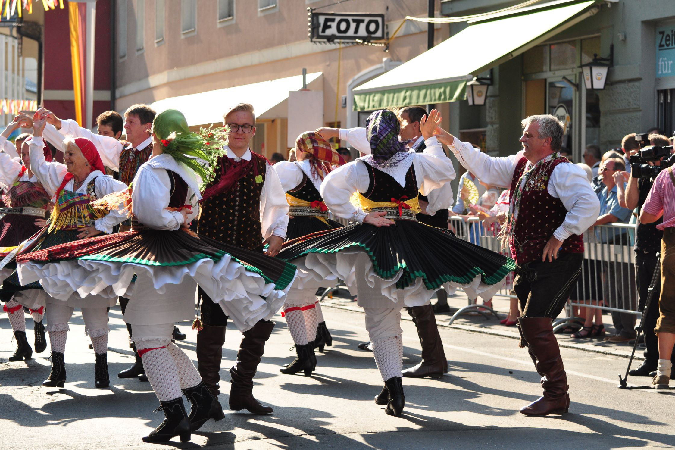 A crowd dancing in traditional clothes of Villacher Kirchtag