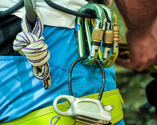 For climbing outdoors you must have a harness, a rope and carabiners