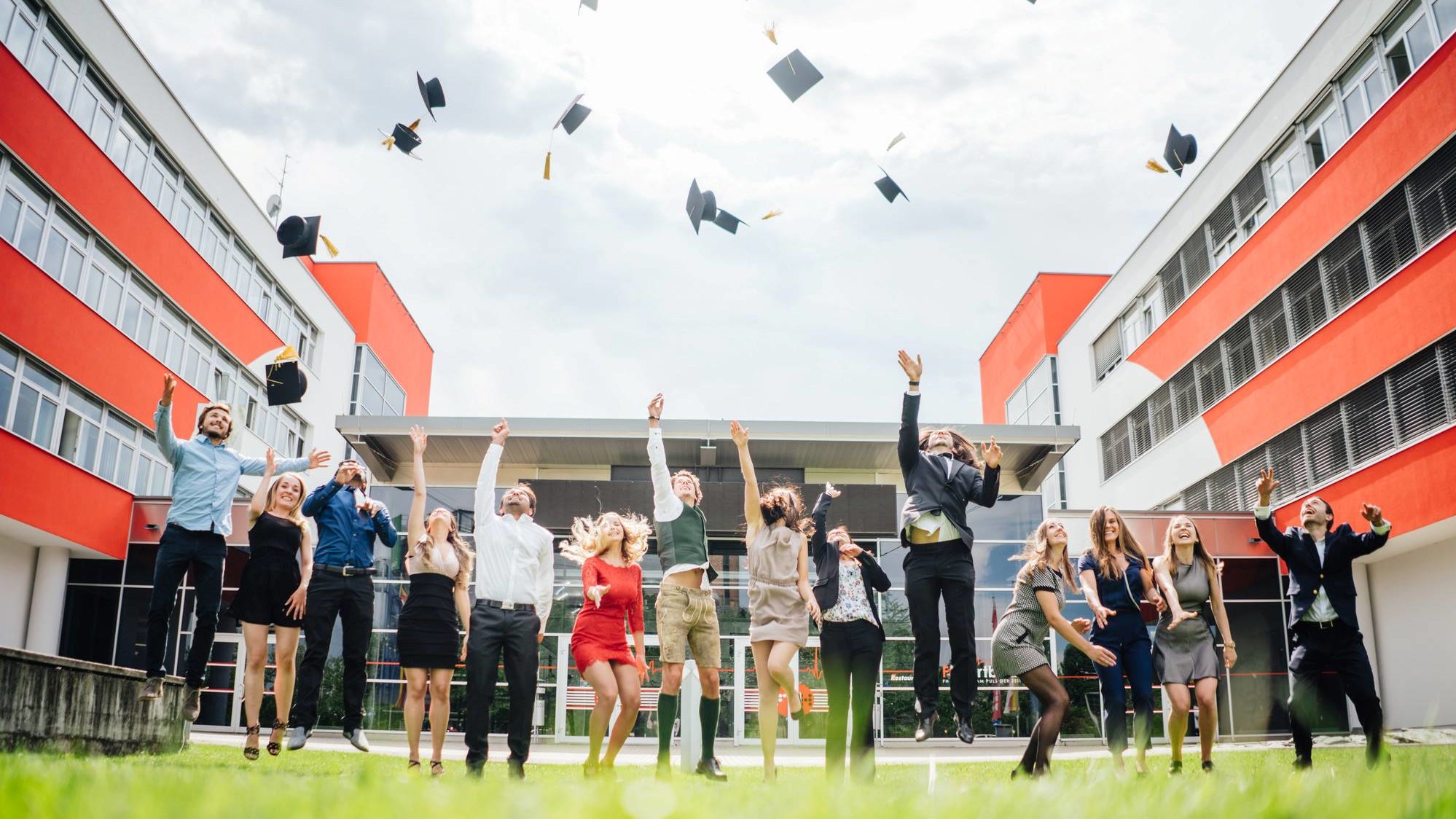 Students throwing their hats in the air for their graduation ceremony