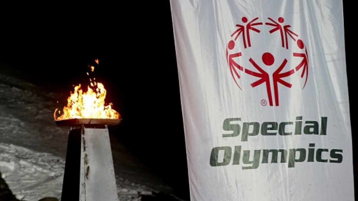 Olympic fire and flag of the Special Olympics The olympic fire starting the Special Olympics