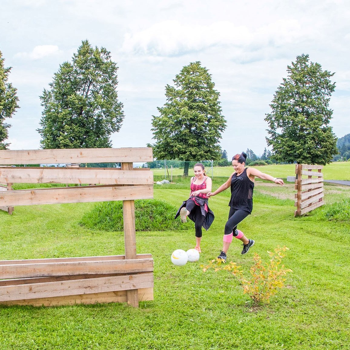 Mother and child playing soccer