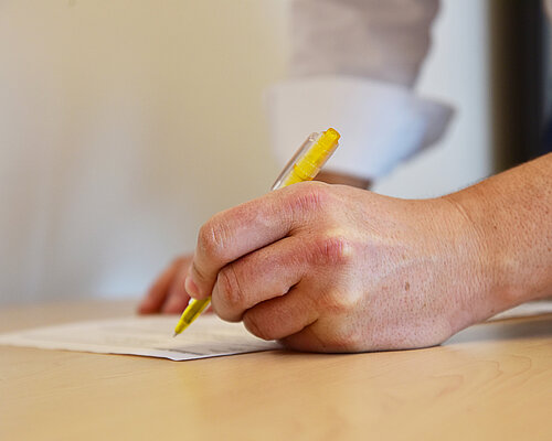 You have to apply for different documents to work in Austria as an expat Filling in a form to get imprortant documents for living in Austria as an expat