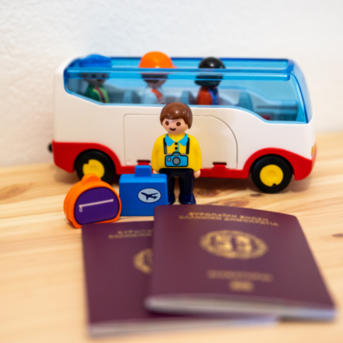 Two passports on a table with lego figures