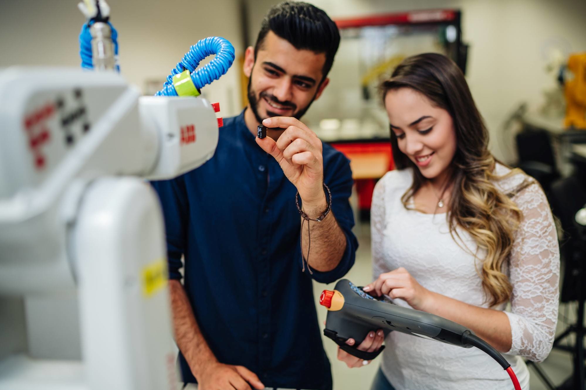 Two students testing their developed devices