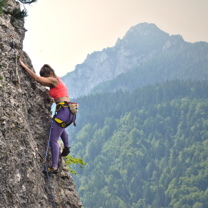 A person is lead climbing at the Kanzianiberg during the festival King of Kanzi