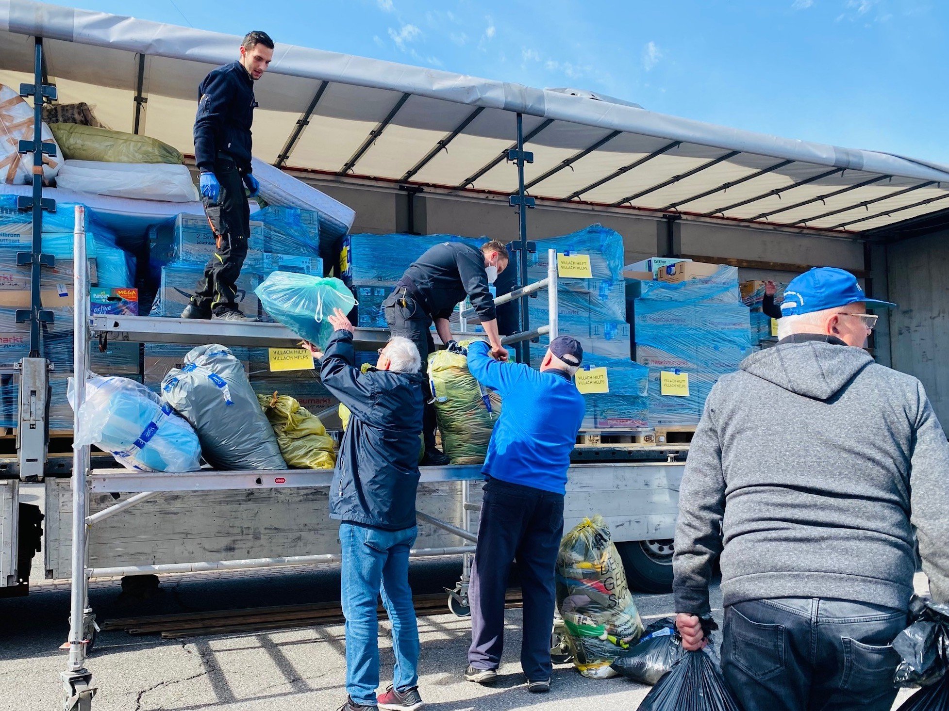 Truck being loaded with food and clothing boxes for Ukraine