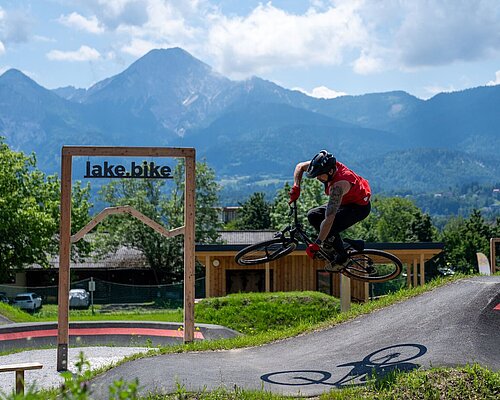Biker jumps on the Drobollach pump track