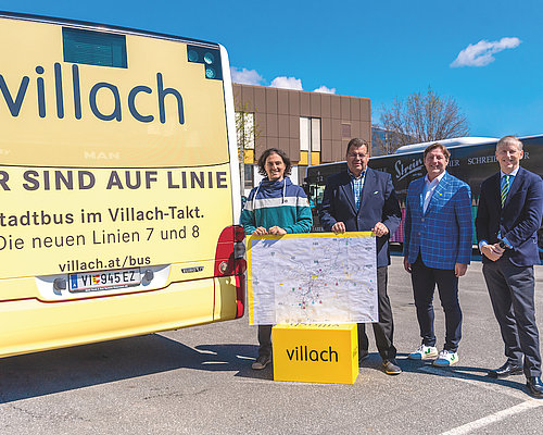 Politicians in front of a Bus