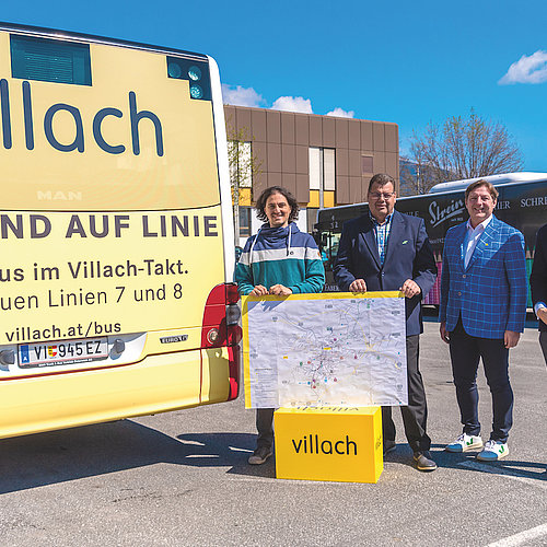 Politicians in front of a Bus