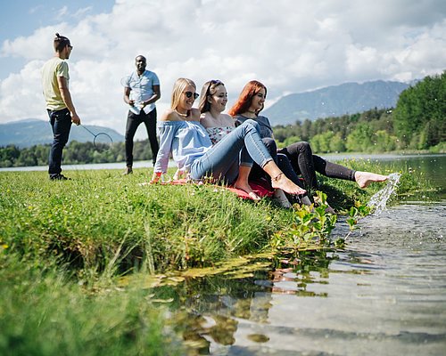 Students sitting at the riverside