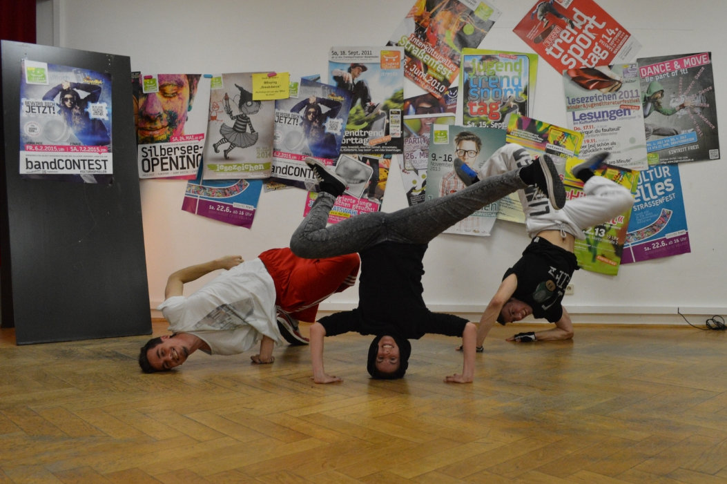 Teens doing break dance poses