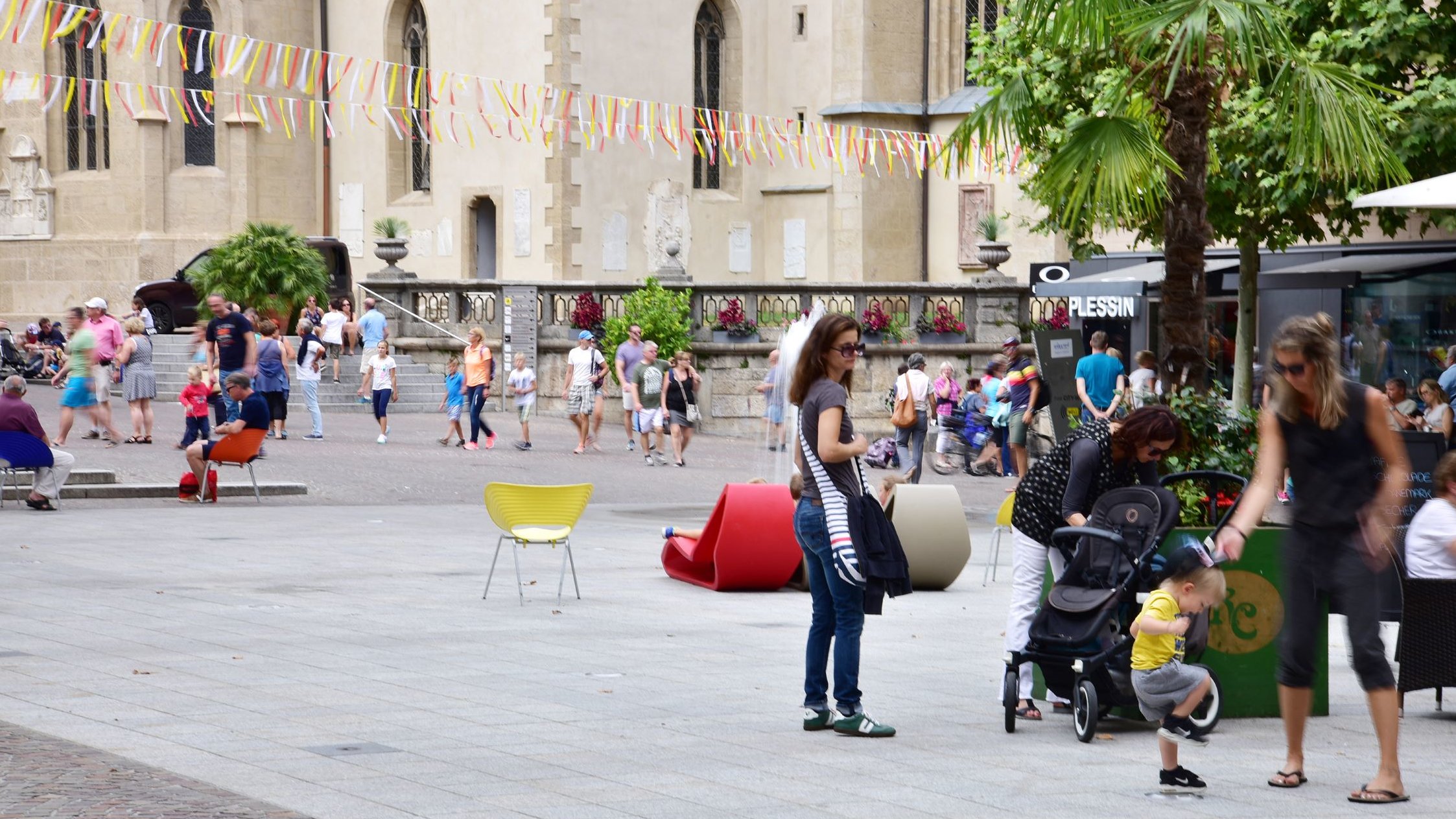 People walking and chilling on a public square