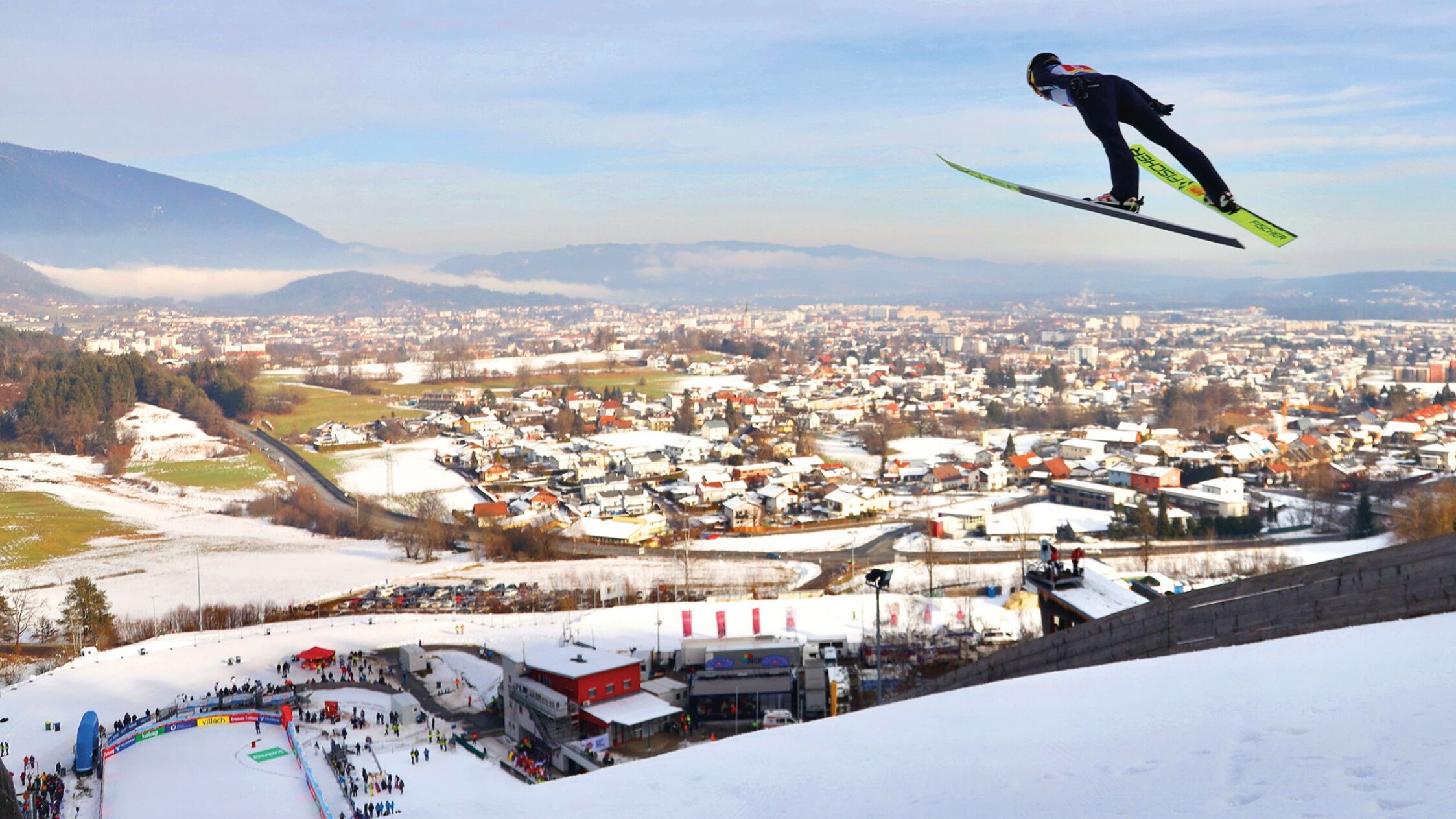 Ski jumper jumping from the hill