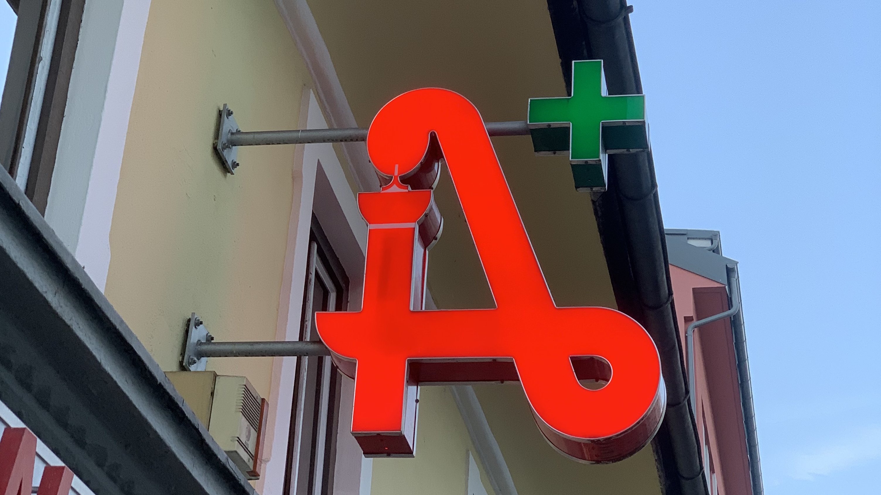 The sign of a pharmacy in Villach