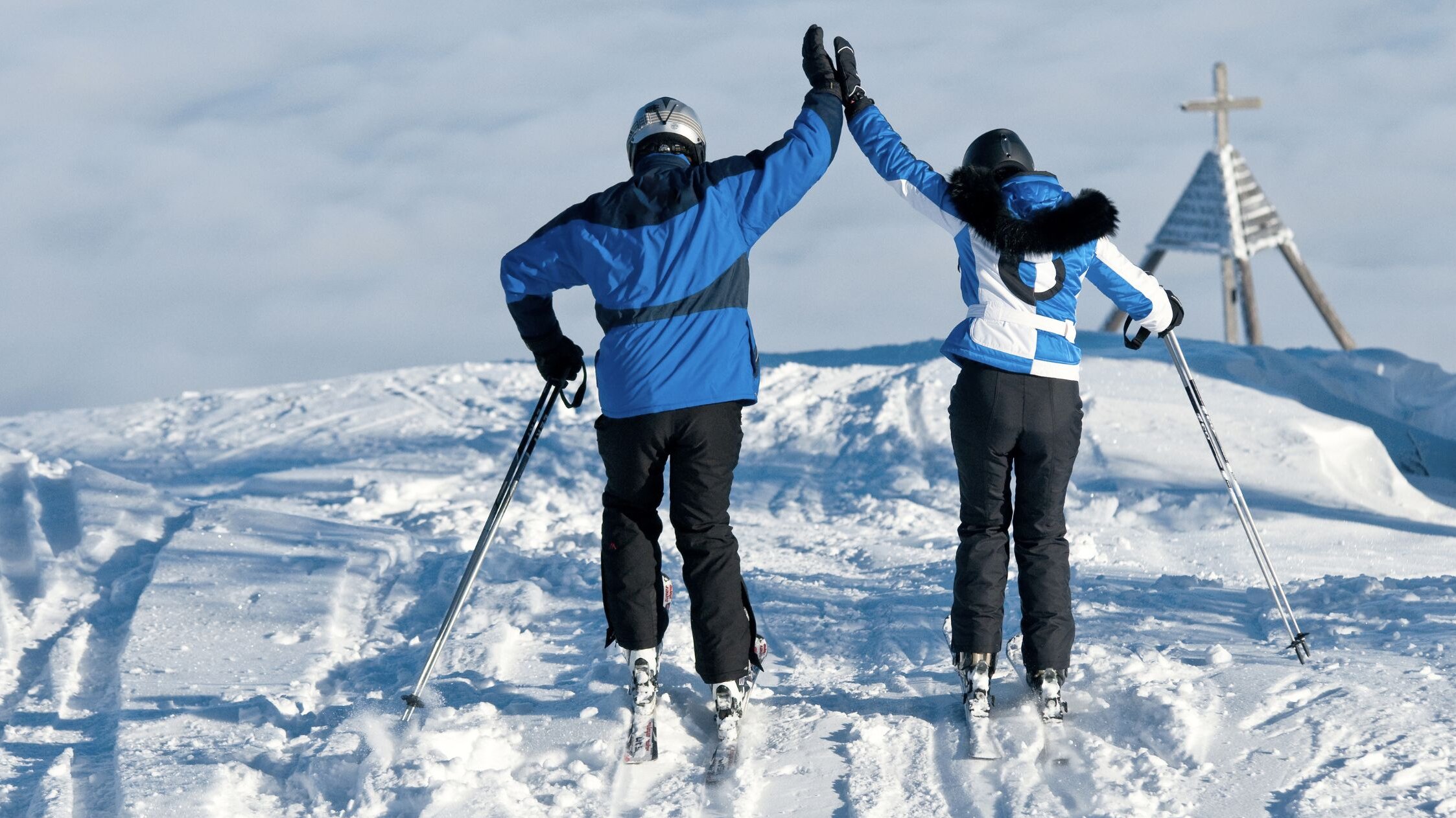 Skiers on the Gerlitzen Alps give each other a high-five