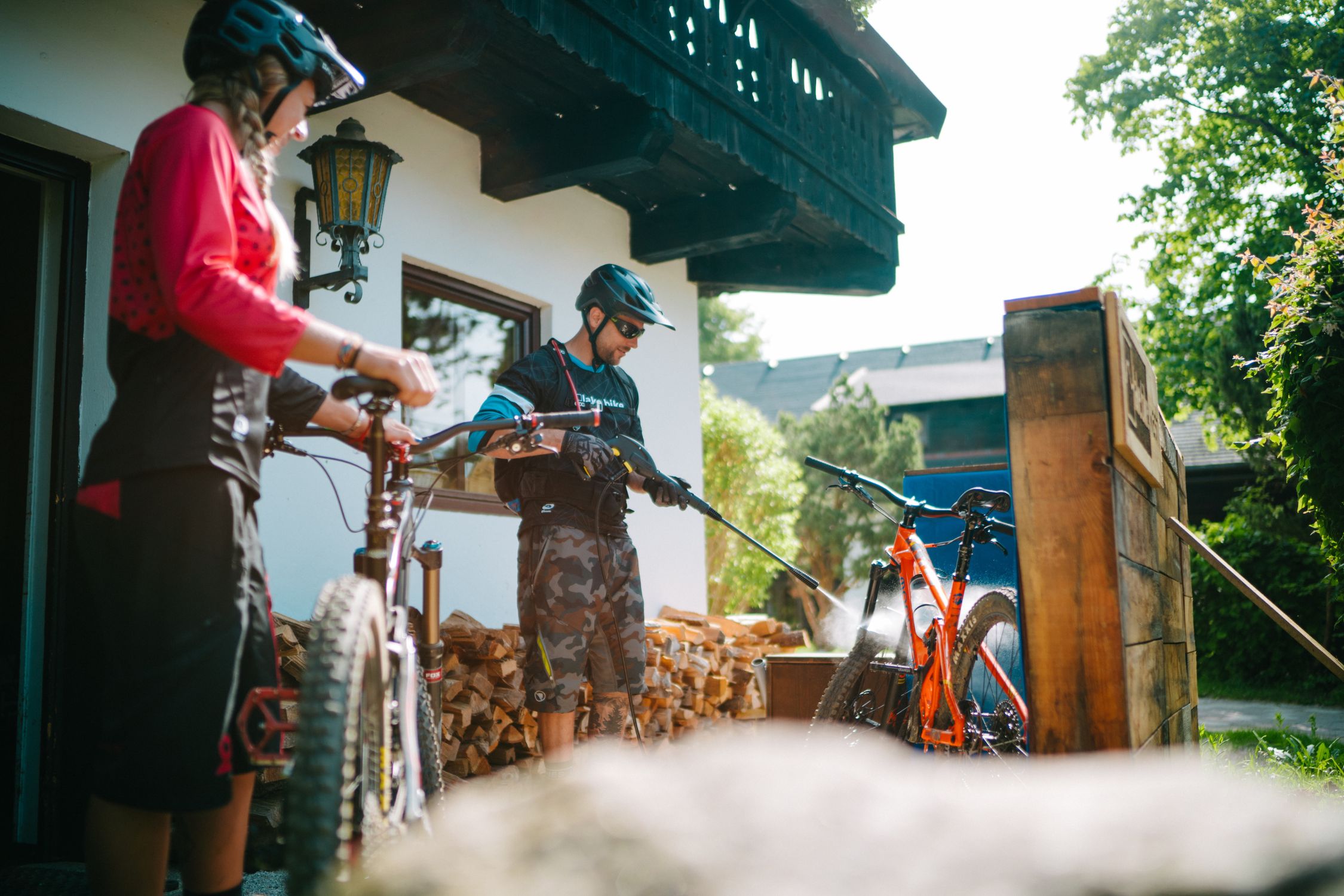 Bikers wash their mountain bikes