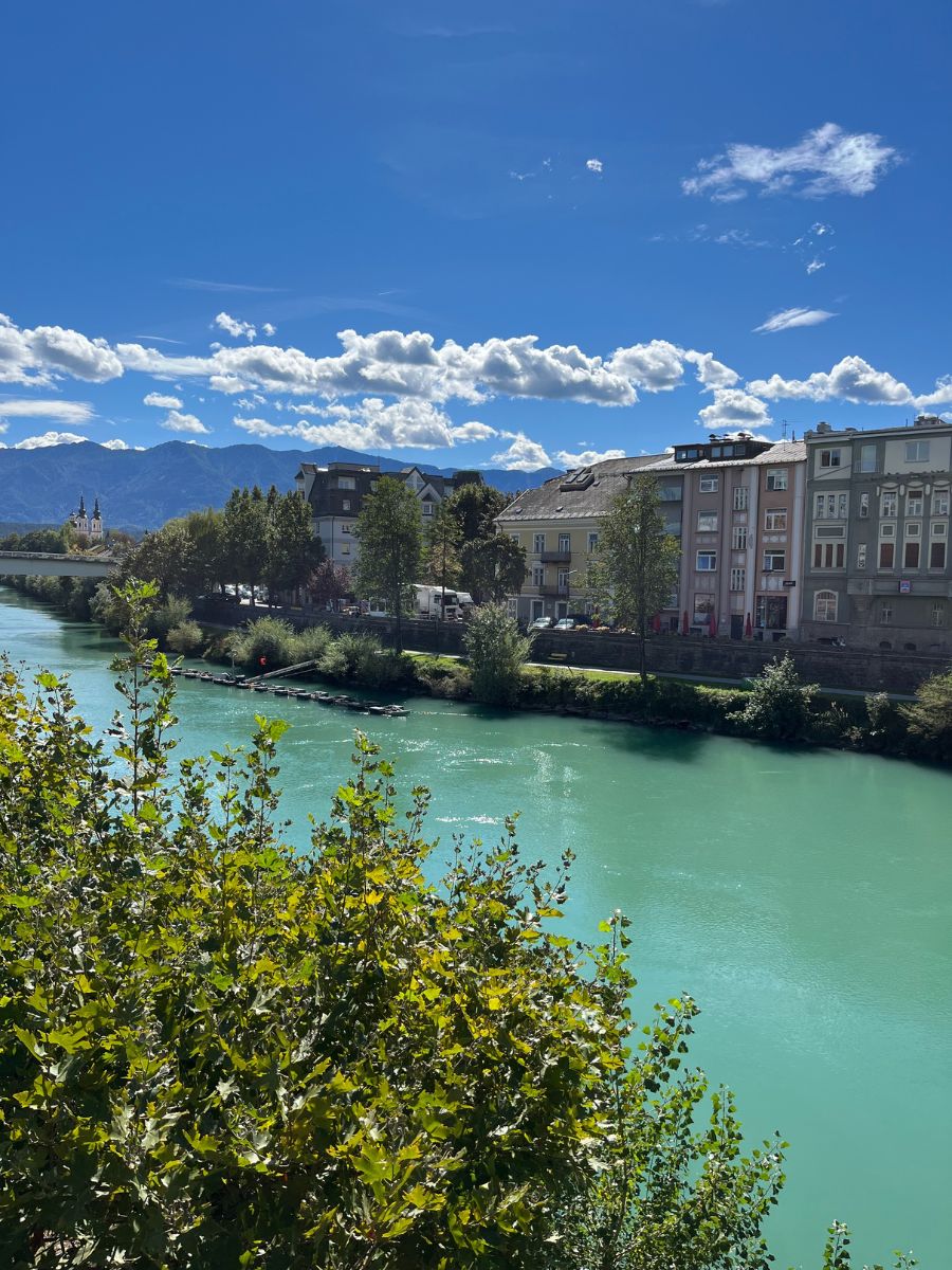 Riverbank with buildings of Villach's inner city