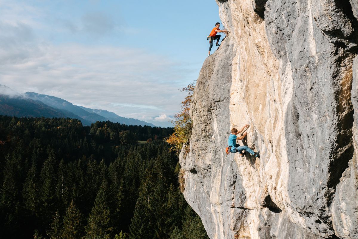 Climbers ascending the rock face