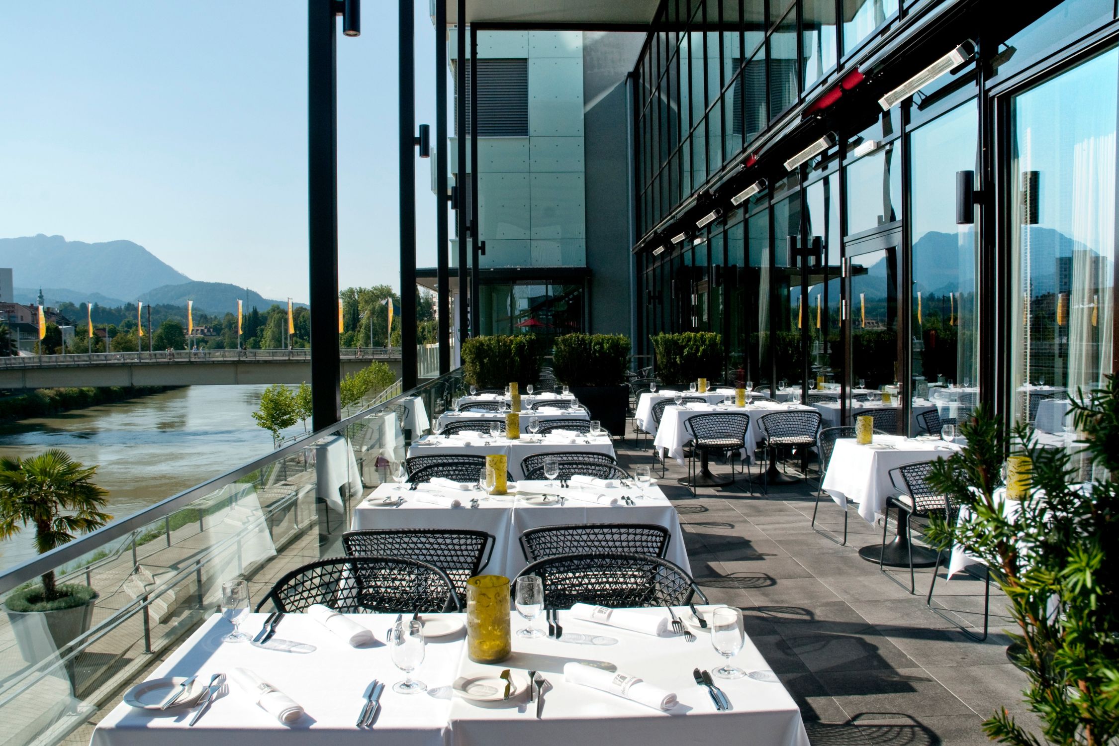  Terrace of the Voco Hotel with a view of the Drau