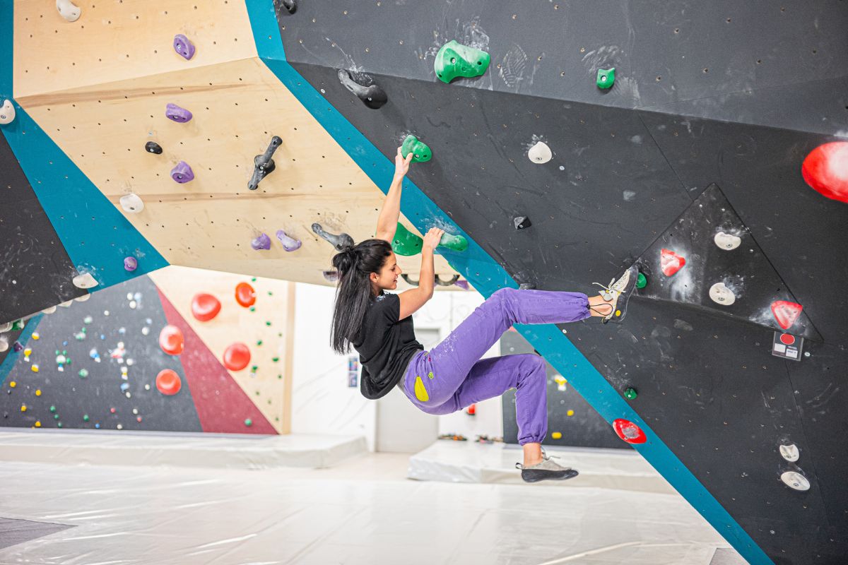 Woman is bouldering